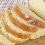 Einkorn basic white yeast bread loaf, sliced to show soft, airy crumb.