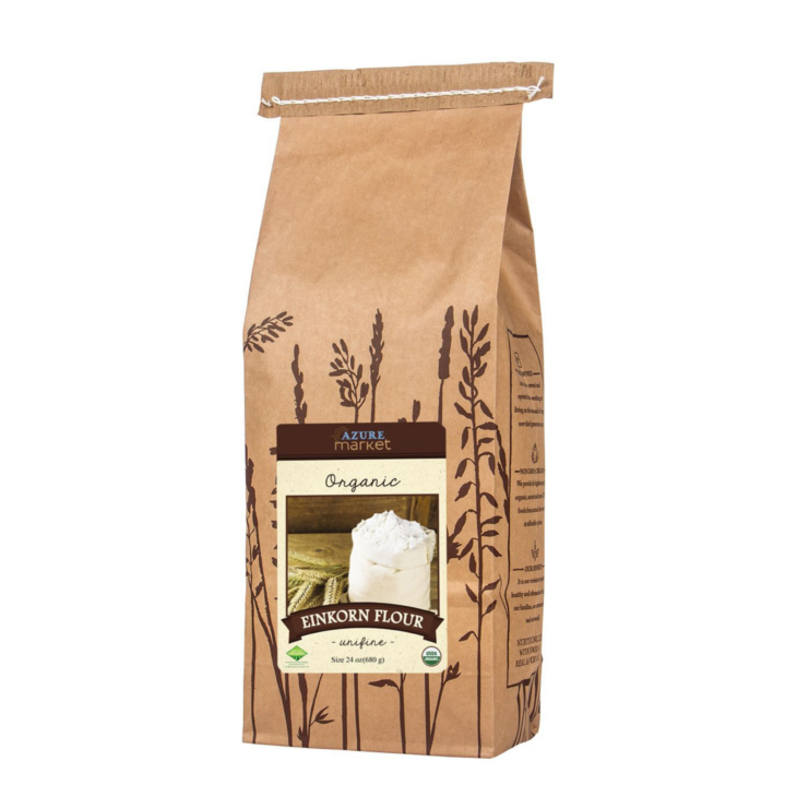 Kraft paper bag of Azure Market Organic Einkorn Flour with a wheat print design.