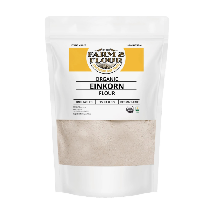 White resealable pouch of Farm2Flour Organic Einkorn Flour, half-filled with flour.